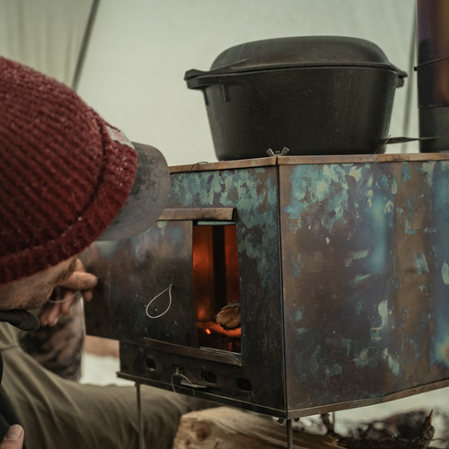 sturdy big mama stove with cast iron ditch oven used to cook food on top of stove