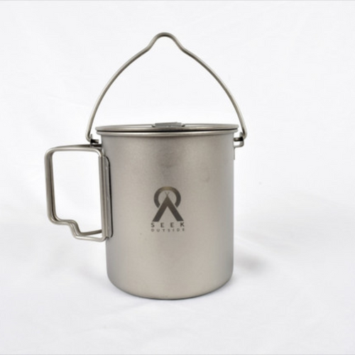 Seek Outside titanium mug with bail handle, regular handle, and lid on white background
