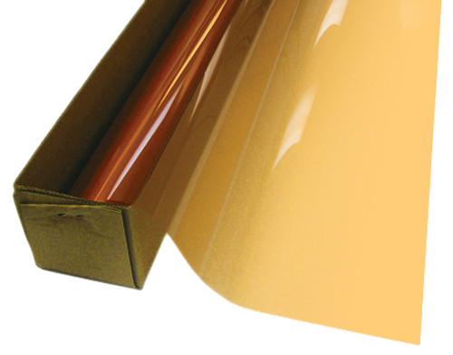 A roll of Straw-colored window film is partially unrolled from a cardboard box.