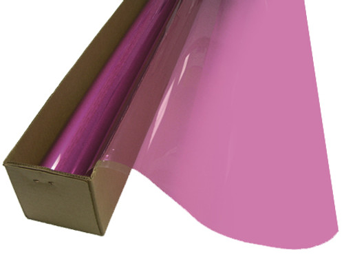 A roll of Orchid-colored window film is partially unrolled from a cardboard box.