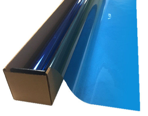 A roll of Summer Blue-colored window film is partially unrolled from a cardboard box.