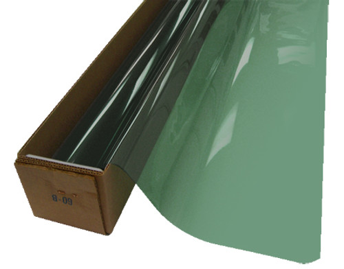 A roll of Celedon-colored window film is partially unrolled from a cardboard box.