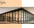 This image showcases a modern glass office building with a portion of its windows covered in Peach window film. The Peach tint creates a striking contrast, casting an appealing hue over the interior space on the left side, while the right side remains untinted and clear. The film enhances both aesthetics and functionality, offering reduced glare and a distinct visual appeal. Above the building image, there is a solid Peach color block labeled "60” Wide Peach 1600," indicating the film’s width and product code.
