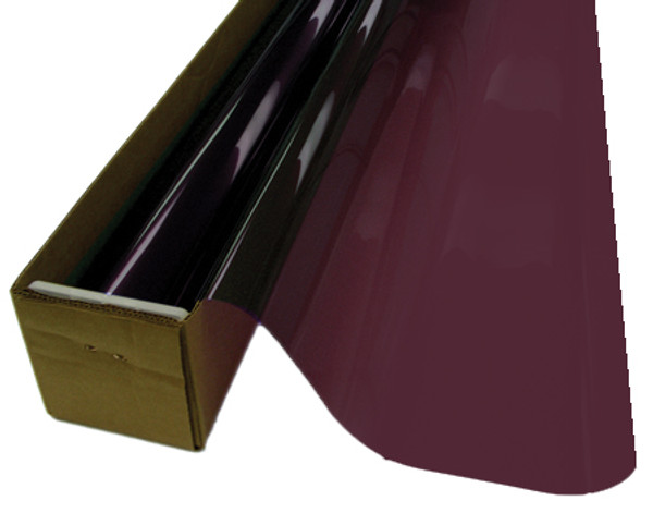 A roll of Plum-colored window film is partially unrolled from a cardboard box. A roll of Plum-colored window film is partially unrolled from a cardboard box.
