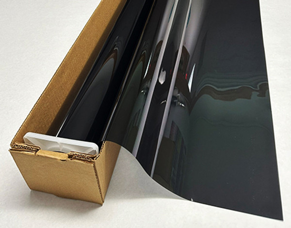 A roll of Smoke 15-colored window film is partially unrolled from a cardboard box.