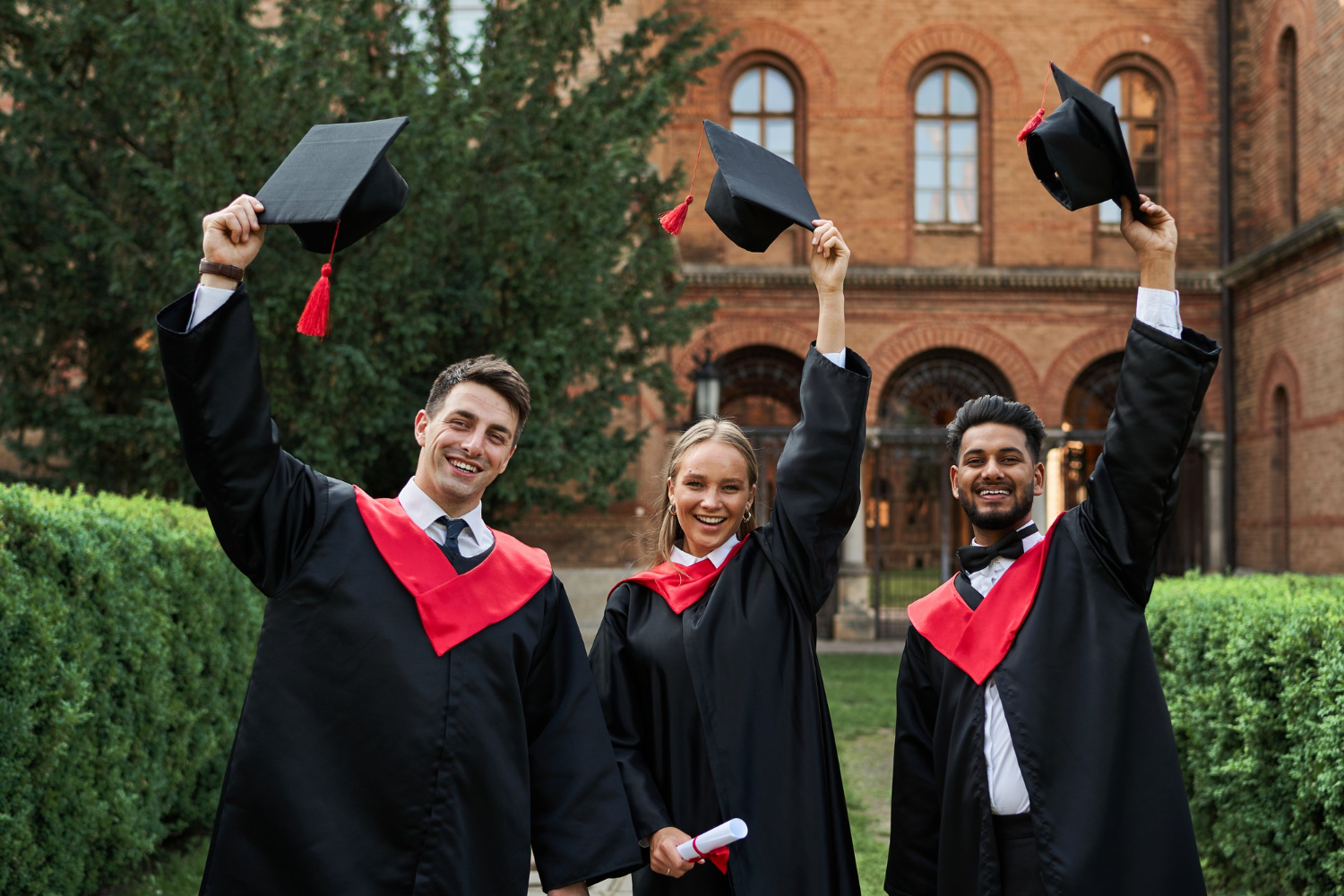 three-students-wearing-graduation-togas.jpg