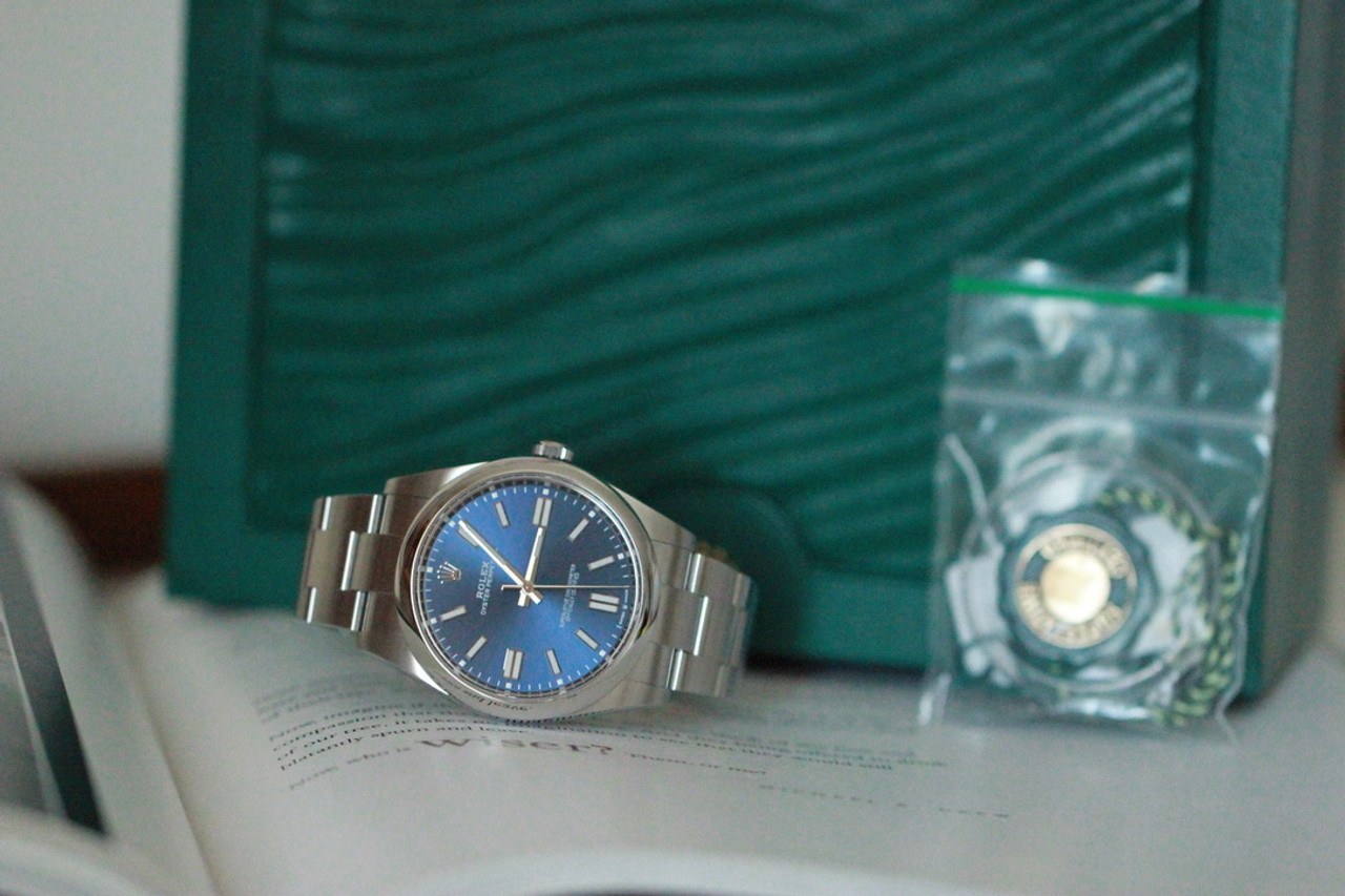 Pre - Owned ROLEX Oyster Perpetual 41 with a bright blue dial and an Oyster  bracelet M124300-0003 Complete