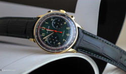 Close-up of green sunburst dial with telemeter and tachymeter scale