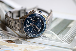 Dive into luxury with the Omega Seamaster Diver 300M Co-Axial Master Chronometer Chronograph. This exceptional timepiece features a robust 44mm stainless steel case paired with a matching stainless steel bracelet, offering both durability and style. The striking blue dial is complemented by luminous hands and markers, ensuring legibility in all lighting conditions, while the unidirectional rotating bezel with a blue ceramic insert enhances the watch's functionality and aesthetic appeal. Dive into luxury with the Omega Seamaster Diver 300M Co-Axial Master Chronometer Chronograph. This exceptional timepiece features a robust 44mm stainless steel case paired with a matching stainless steel bracelet, offering both durability and style. The striking blue dial is complemented by luminous hands and markers, ensuring legibility in all lighting conditions, while the unidirectional rotating bezel with a blue ceramic insert enhances the watch's functionality and aesthetic appeal.