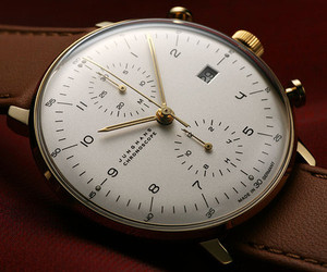 Gold color wristwatch - Junghans Max Bill Chronoscope with Date, Silver dial on a brown leather strap. Modern Bauhaus style. Made in Germany. For sale from an Authorized Dealer located in Chicago. Gold color wristwatch - Junghans Max Bill Chronoscope with Date, Silver dial on a brown leather strap. Modern Bauhaus style. Made in Germany. For sale from an Authorized Dealer located in Chicago.