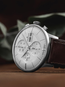 The Junghans 27/4120.03 Meister Chronoscope, English Date is a watch that features a self-winding movement with a power reserve of up to 48 hours. It has a date and day indicator, a small seconds subdial, and chronoscope functions. The watch also has a sapphire crystal and is water resistant to 50 meters. For Sale from and Authorized Junghans Dealer Legend of Time Chicago. The Junghans 27/4120.03 Meister Chronoscope, English Date is a watch that features a self-winding movement with a power reserve of up to 48 hours. It has a date and day indicator, a small seconds subdial, and chronoscope functions. The watch also has a sapphire crystal and is water resistant to 50 meters. For Sale from and Authorized Junghans Dealer Legend of Time Chicago.