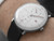 Front view of the Junghans Max Bill Regulator Bauhaus white regulator dial