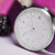 Dial close up Junghans Max Bill Damen 47/4558.02 white dial watch with purple numerals and purple leather strap