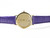 18K yellow gold Maurice Lacroix wristwatch with champagne dial, slim 26mm case, and purple Hirsch leather strap, displayed at an angle highlighting its polished case and refined stick hour markers.