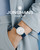 Junghans Max Bill Damen 47/4540.02 white dial watch with blue numerals and blue leather strap on the wrist