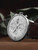 The Junghans 27/4120.03 Meister Chronoscope, English Date is a watch that features a self-winding movement with a power reserve of up to 48 hours. It has a date and day indicator, a small seconds subdial, and chronoscope functions. The watch also has a sapphire crystal and is water resistant to 50 meters. For Sale from and Authorized Junghans Dealer Legend of Time Chicago.