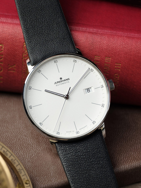 The Junghans Form A is a men's watch with an automatic movement, a matte silver dial, and a black leather strap. It has a 39.1 mm case size, a mineral crystal case back, and luminous silver-tone hands. The watch is made in Germany and has a two-year warranty. It is water-resistant up to 5 bar and has a leather strap.