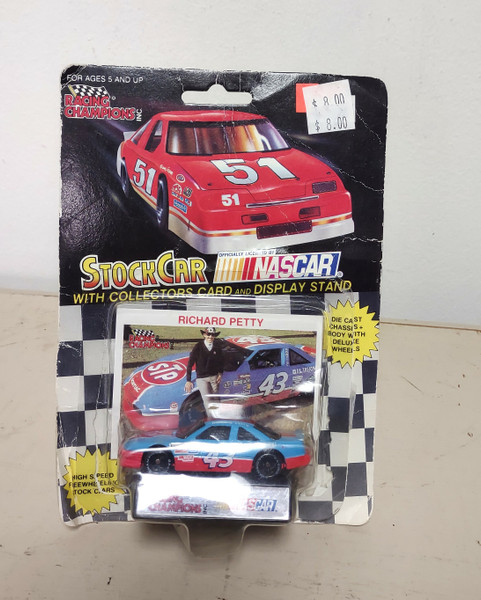 1992 Racing Champions 1:64 #43 Richard Petty/STP Black Wheels - Damaged Package