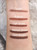 Retractable Waterproof Brow liner color samples on woman's arm. This waterproof brow liner is the perfect tool to keep any redhead's eyebrows looking flawless all day.