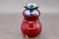 Ruby Red Vase with copper rim, roughly 4" wide 6.5" tall with 1.5" opening (SK7853)