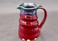 Ruby Red Pitcher with copper rim, roughly 5 inches wide (with handle) by 6.5 inches tall, (SK7895)