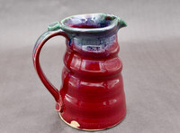 Ruby Red Pitcher with copper rim, roughly 5 inches wide (with handle) by 6.5 inches tall, (SK7895)