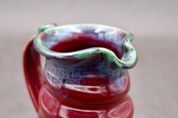 Ruby Red Pitcher with copper rim, roughly 5 inches wide (with handle) by 6.5 inches tall, (SK7895)