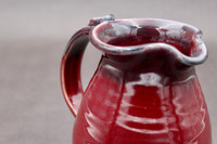 Ruby Red toned Pitcher, roughly 5.5 inches wide (with handle) by 6.5 inches tall, (SK7894)