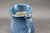 Nuka Cobalt Pitcher, roughly 7" wide (including handle) by 8.5" tall, (SK0373)