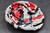 Copy of Splashy Red Spoon Rest, roughly 5" wide by 1.25" tall (SK0802)