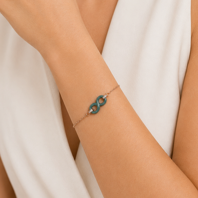 Bracelet en acier inoxydable rosé & céramique verte, zircons et motif infini