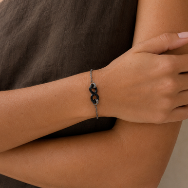 Bracelet en acier inoxydable & céramique noire, zircons et motif infini