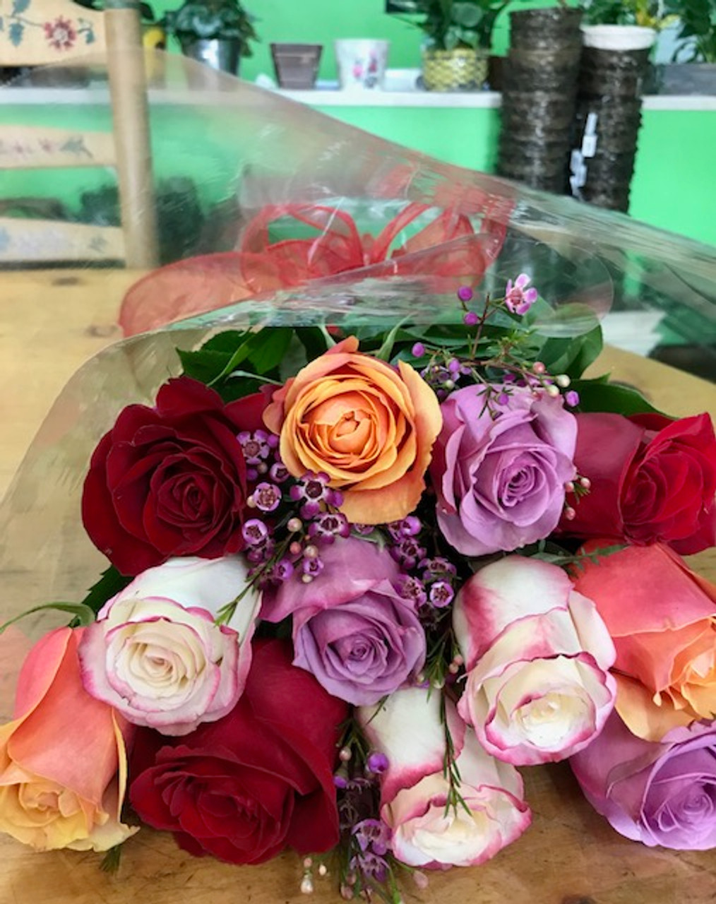 Dozen Assorted Roses Wrapped in Love by Belvedere Flowers