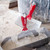 Drywall putty knife and mud pan on construction site Drywall putty knife and mud pan on construction site