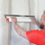 Composite-body drywall skimming blade in use