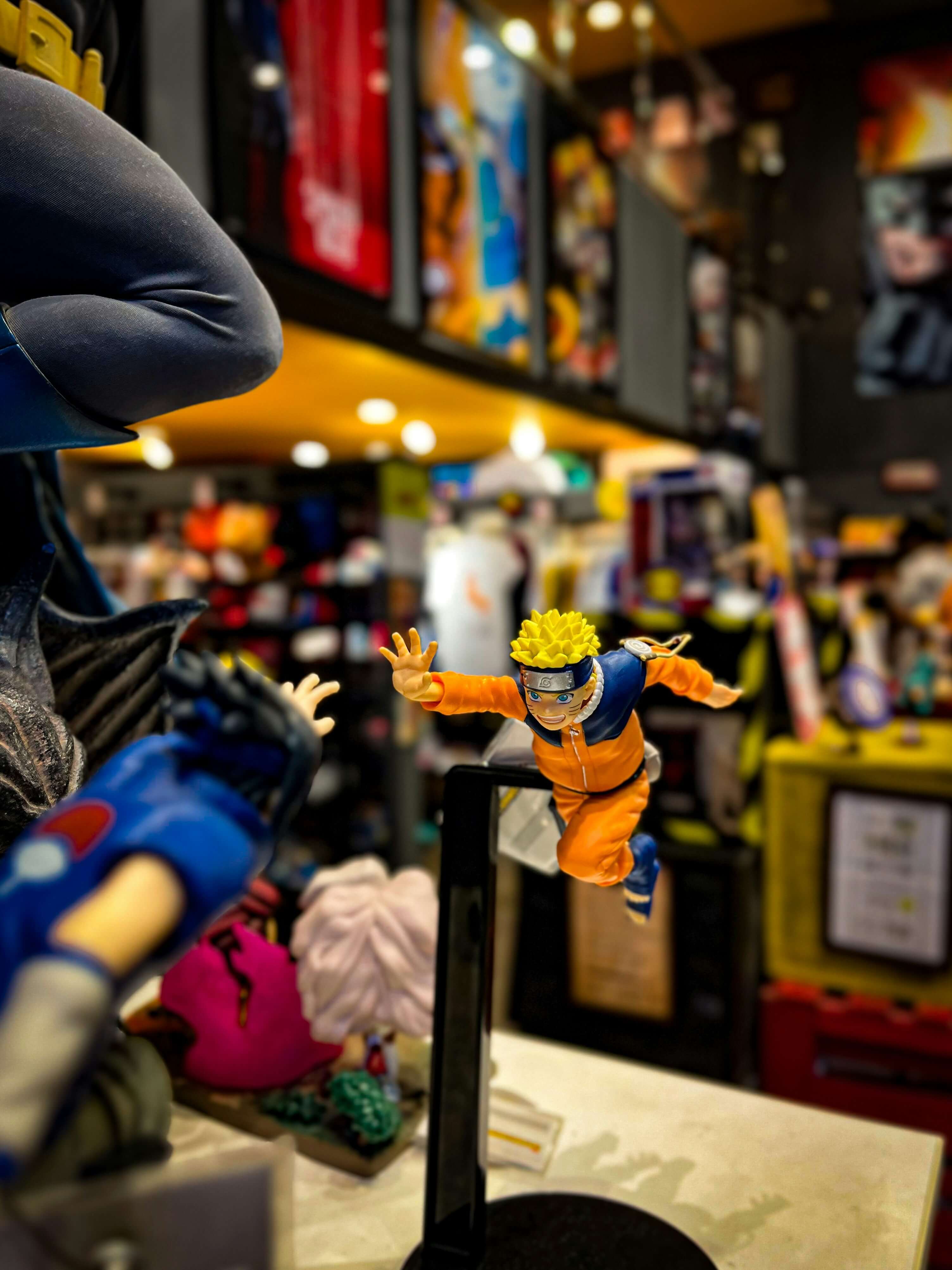 Naruto action figures high fiving each other
