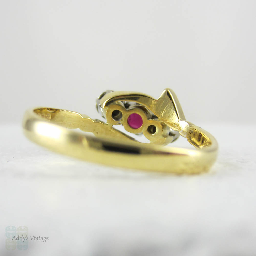 Vintage Ruby & Diamond Engagement Ring, Trilogy Ring in Bypass Twist Style. Engraved Leaf Design Setting, 18 Carat Gold, Circa 1960s.