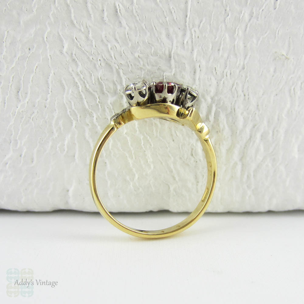 Vintage Ruby & Diamond Engagement Ring, Trilogy Ring in Bypass Twist Style. Engraved Leaf Design Setting, 18 Carat Gold, Circa 1960s.
