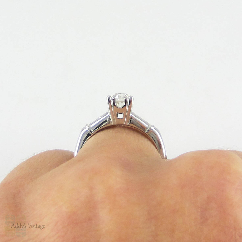 Transitional Cut Diamond Engagement Ring, Tapered Baguette Platinum Setting with Triple Claw Style Prongs, 0.86 ctw, Circa 1930s.