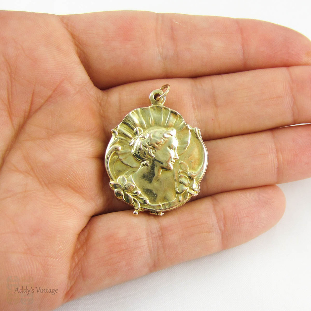 Art Nouveau Locket with Womans Figure & Floral Design, 9 Carat Yellow Gold Photograph Locket, Circa 1910s.