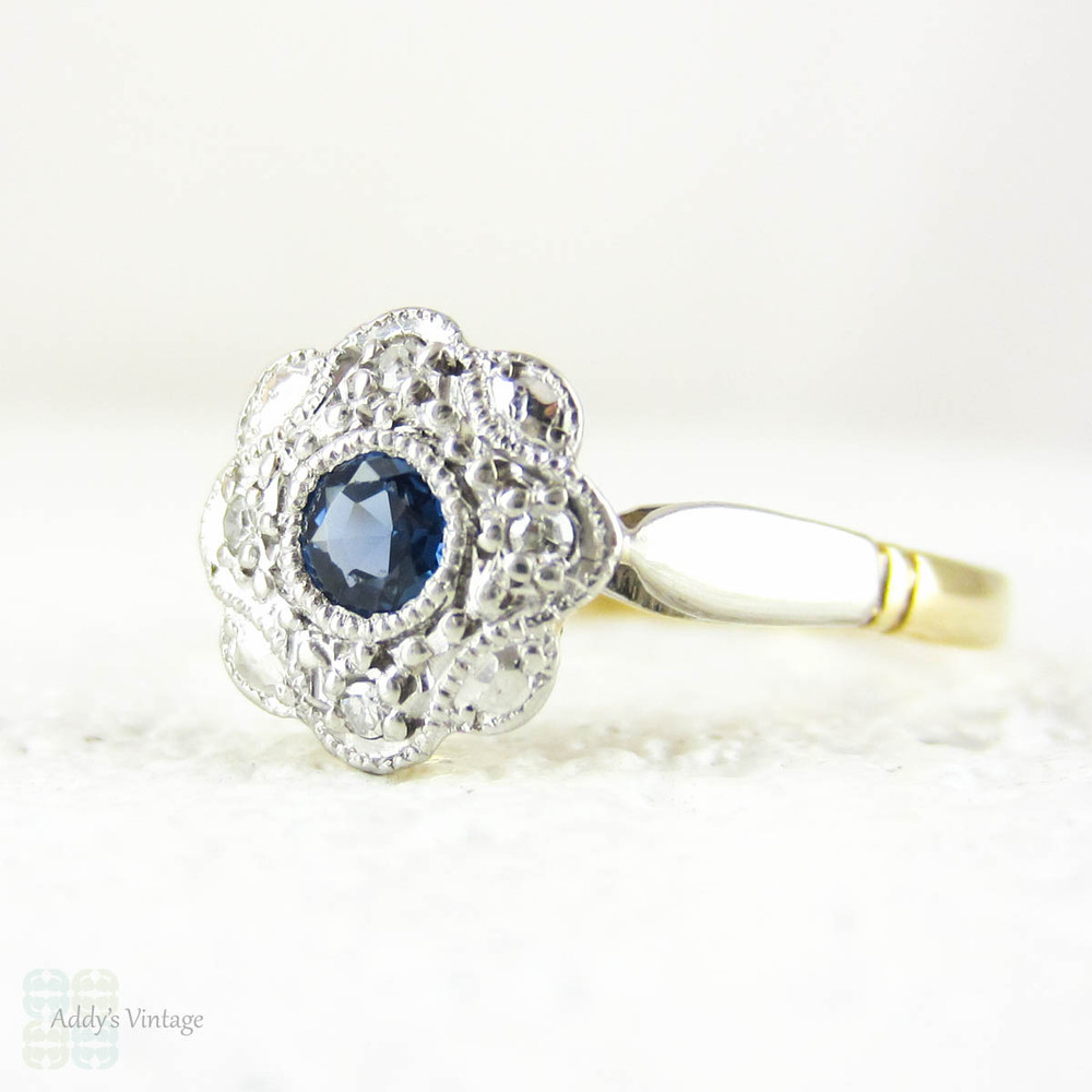 Sapphire & Diamond Daisy Engagement Ring, Blue Sapphire in Floral Shape Diamond Halo with Milgrain. Circa 1930s, 18ct & Platinum.
