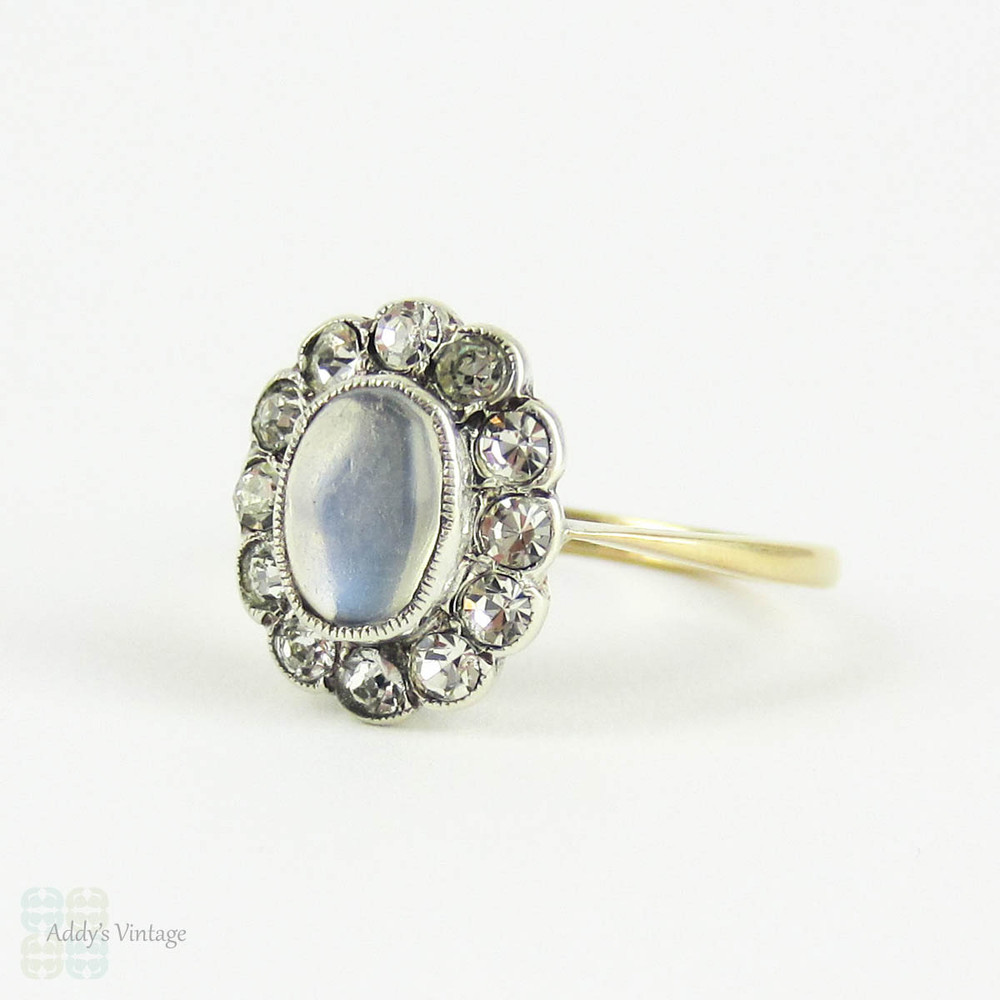 Vintage Moonstone & Paste Halo Ring, Oval Cabochon Moonstone with Diamond Paste Halo in 9 Carat Yellow Gold in Sterling Silver, Circa 1930s.
