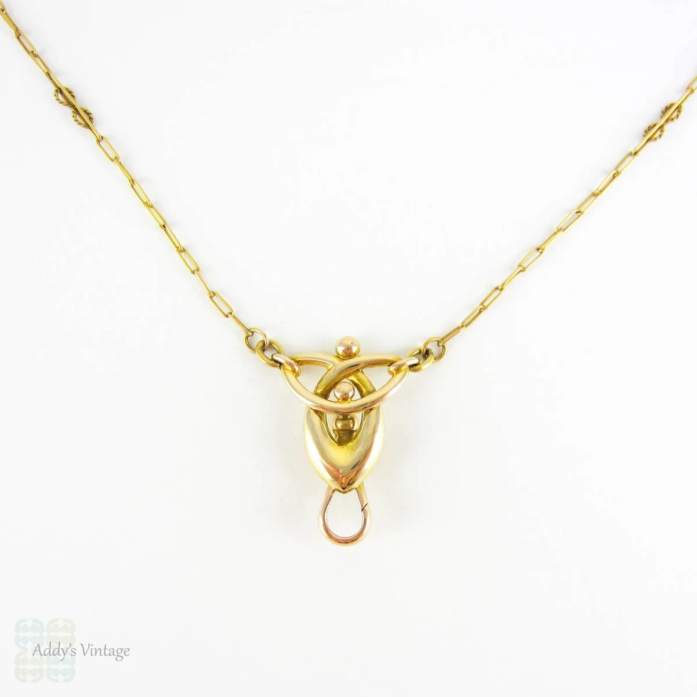 BALANCE. Art Nouveau 15ct Gold Necklace, Fancy Trombone Link Chain with Large Knot Design Pendant and Dog Clip for Pendant, Circa 1910s.