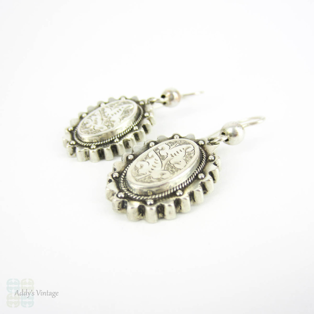 Victorian Aesthetic Movement Earrings, Sterling Silver Engraved Floral Foliate Design Oval Shape Dangle Earrings, Circa 1880s.
