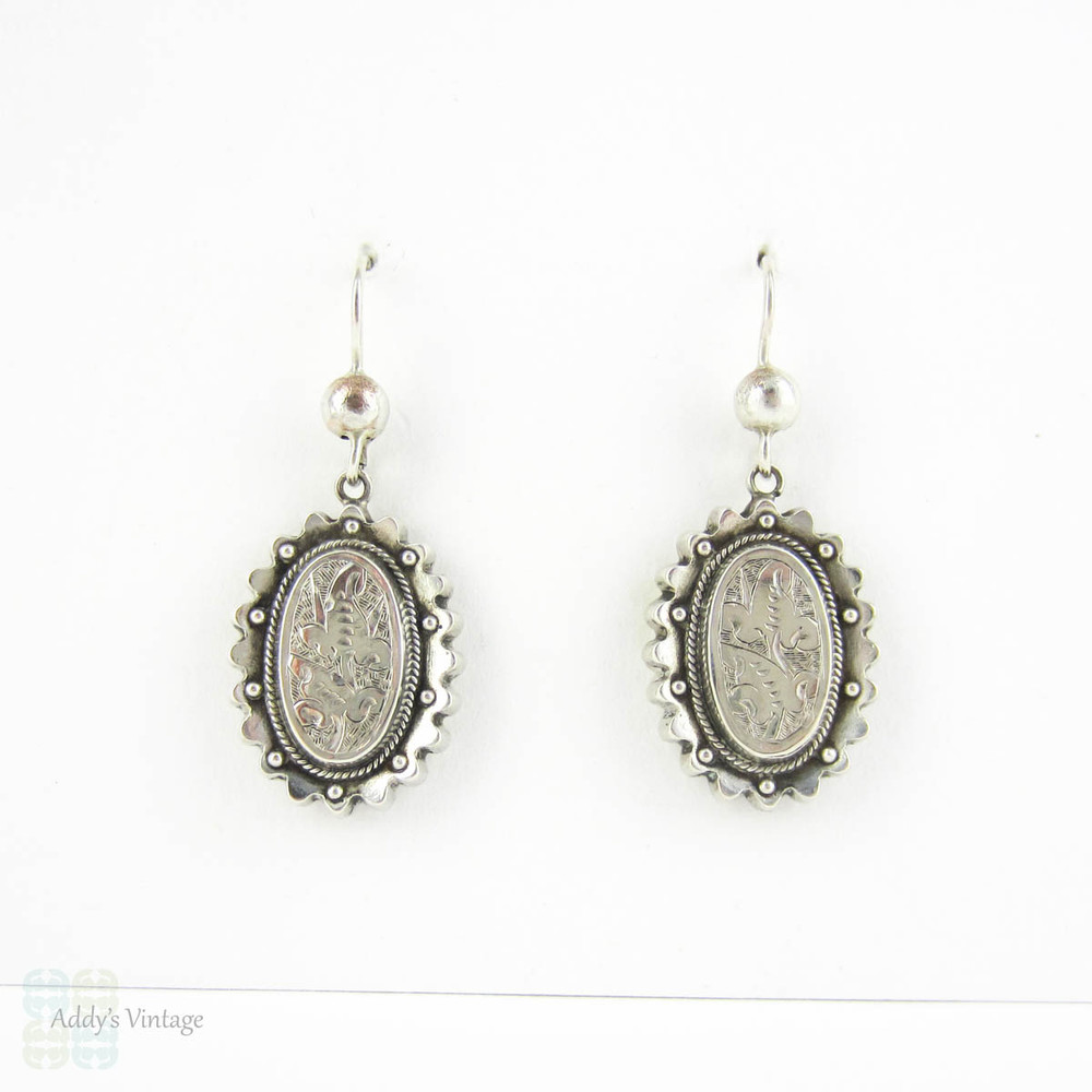 Victorian Aesthetic Movement Earrings, Sterling Silver Engraved Floral Foliate Design Oval Shape Dangle Earrings, Circa 1880s.