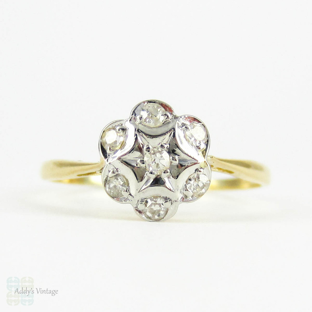 Antique Floral Shape Engagement Ring, 7 Stone Diamond Cluster Ring in Daisy Flower Design. Circa 1910s, 18 Carat Gold.
