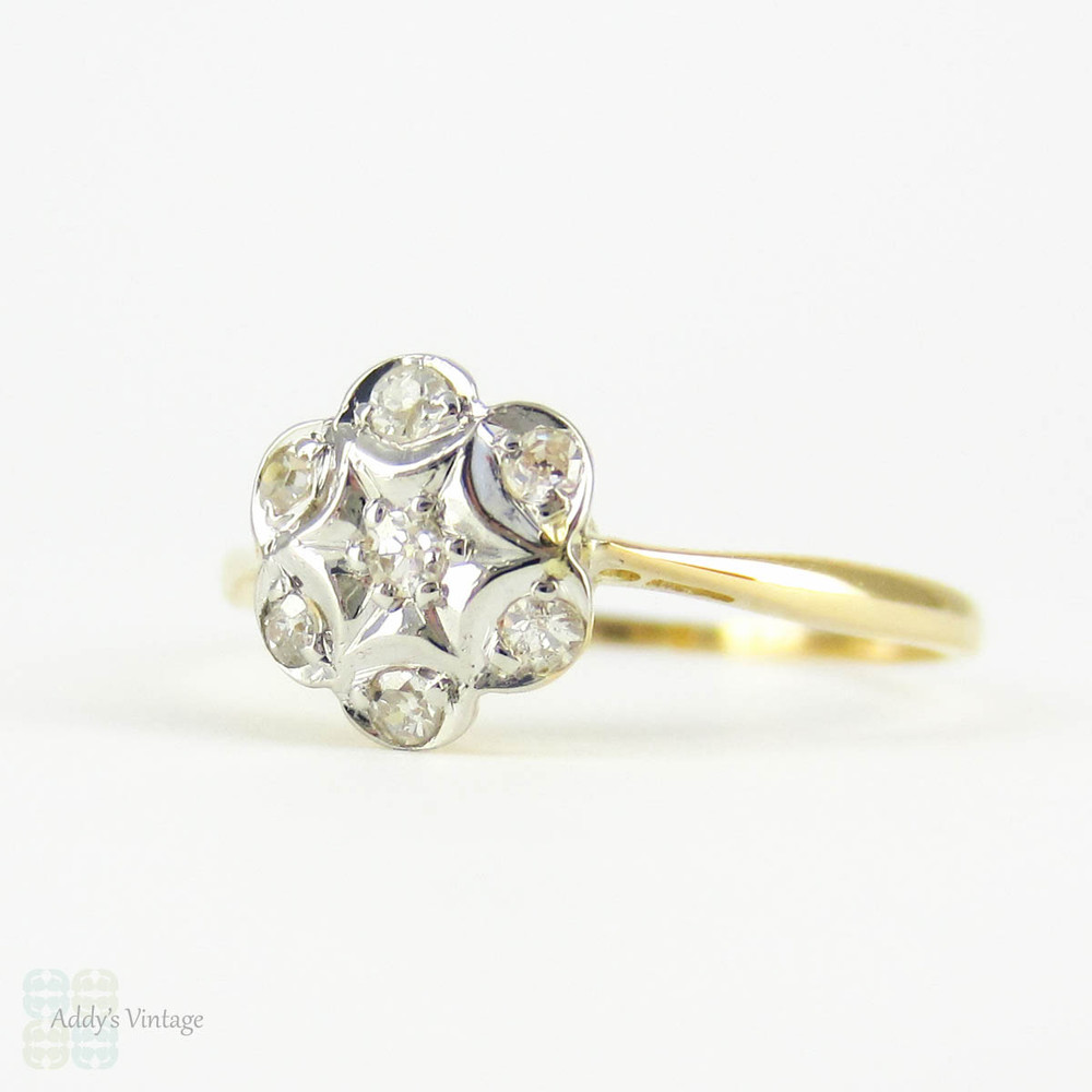 Antique Floral Shape Engagement Ring, 7 Stone Diamond Cluster Ring in Daisy Flower Design. Circa 1910s, 18 Carat Gold.