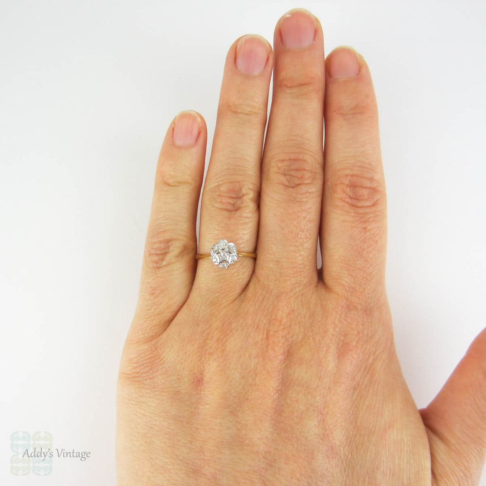 Antique Floral Shape Engagement Ring, 7 Stone Diamond Cluster Ring in Daisy Flower Design. Circa 1910s, 18 Carat Gold.