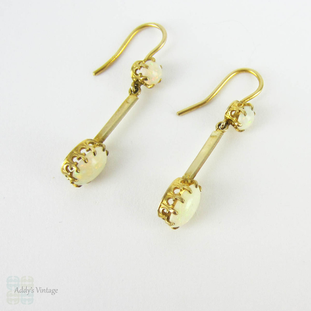 Antique Opal Dangle Earrings, Double Oval Cabochon Cut Opal. Circa 1900s, 9 Carat Yellow Gold.
