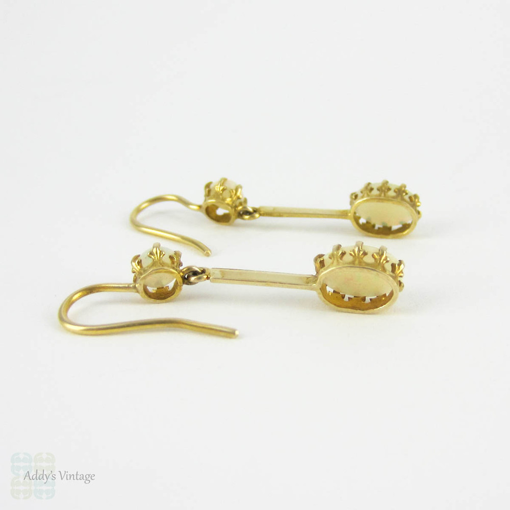 Antique Opal Dangle Earrings, Double Oval Cabochon Cut Opal. Circa 1900s, 9 Carat Yellow Gold.